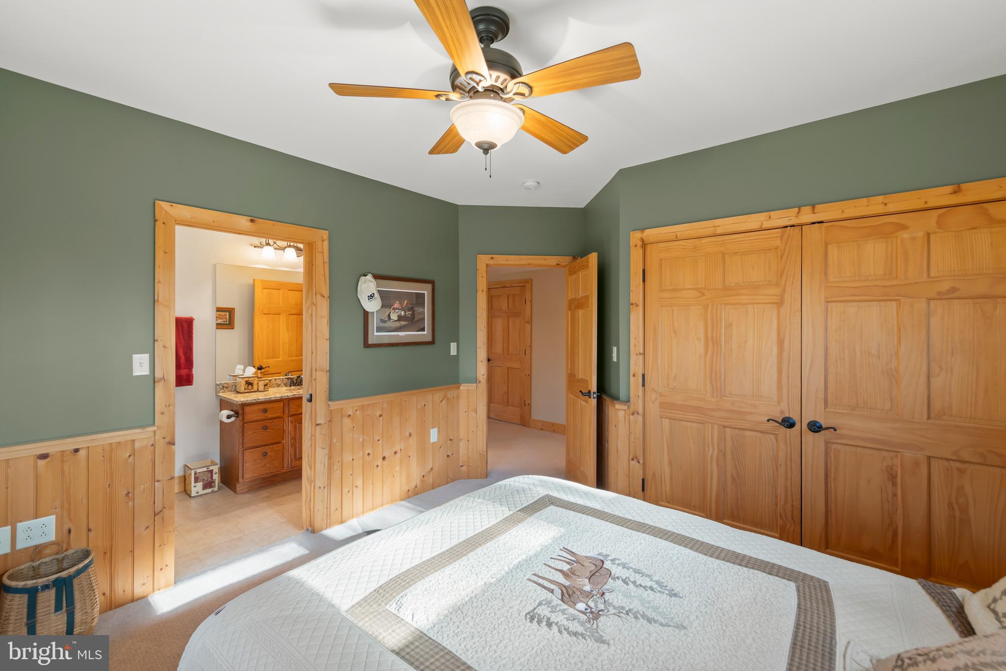 181 Signal Ridge Lane Winchester, VA 22603 - Photo 45 of 70 a bedroom with a bed and a chandelier