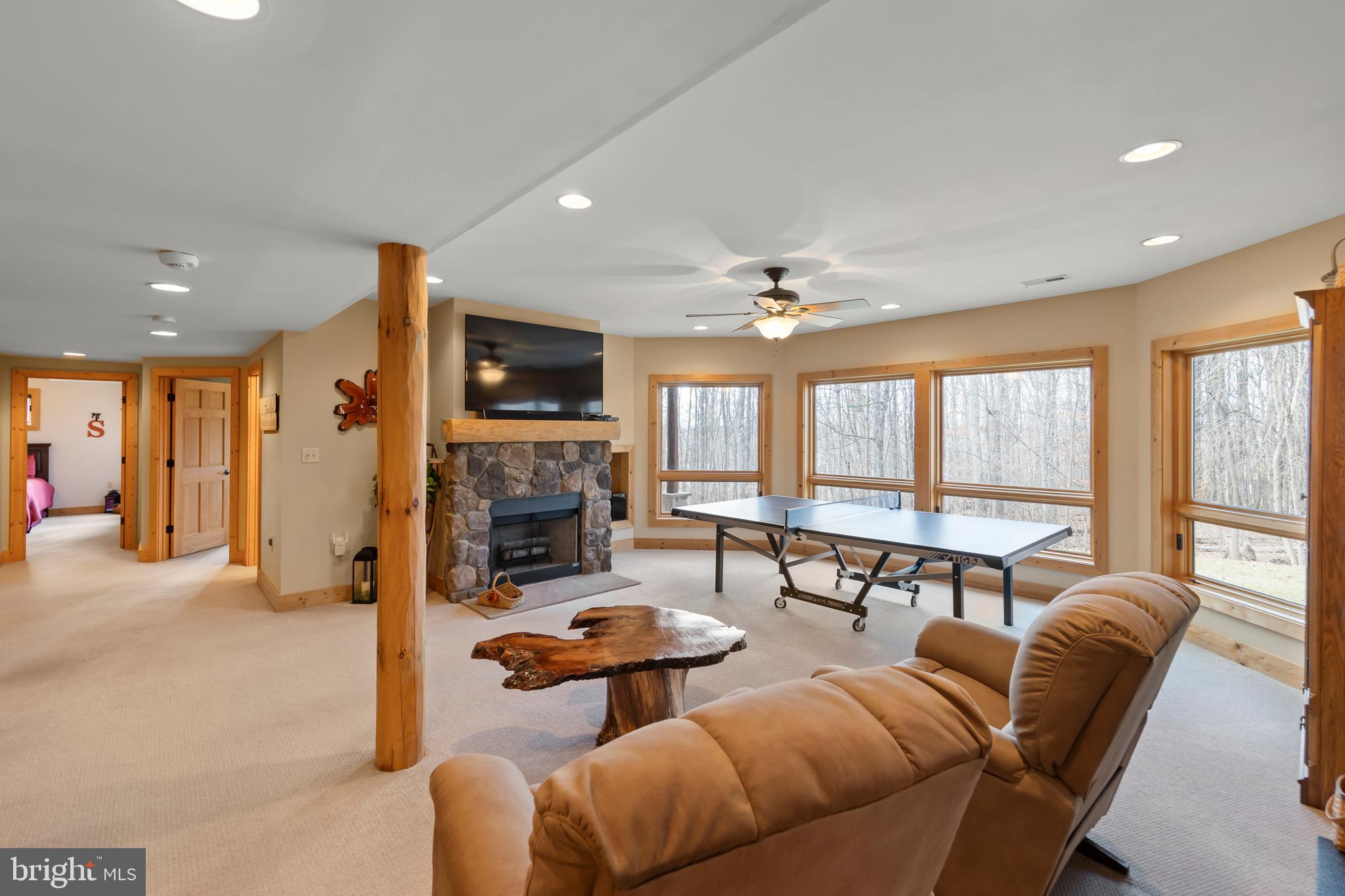 181 Signal Ridge Lane Winchester, VA 22603 - Photo 50 of 70 a living room with fireplace furniture and a large window