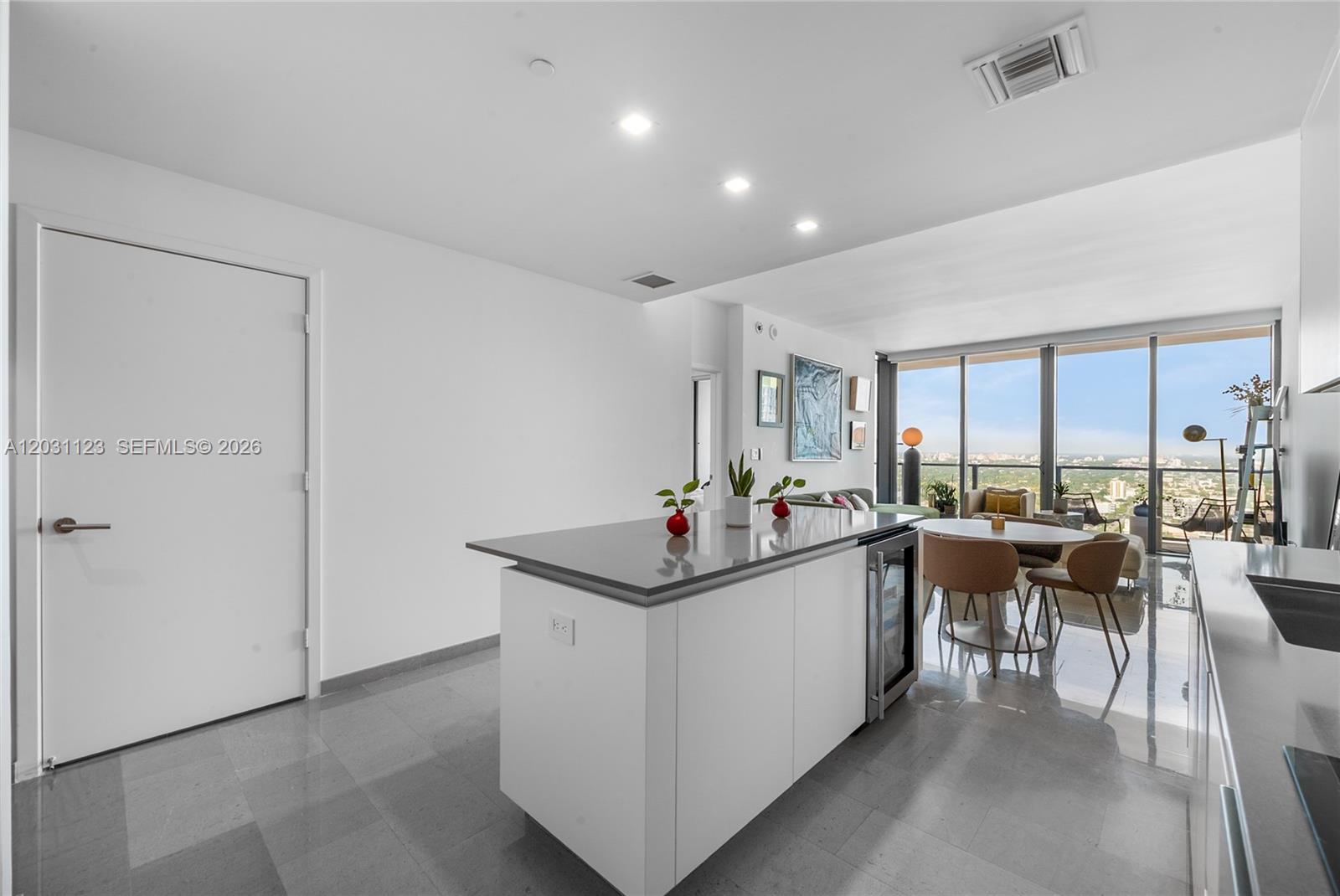 88 Southwest 7th Street, Unit 3208 Miami, FL 33130 - Photo 13 of 16 a living room with furniture a window and kitchen view
