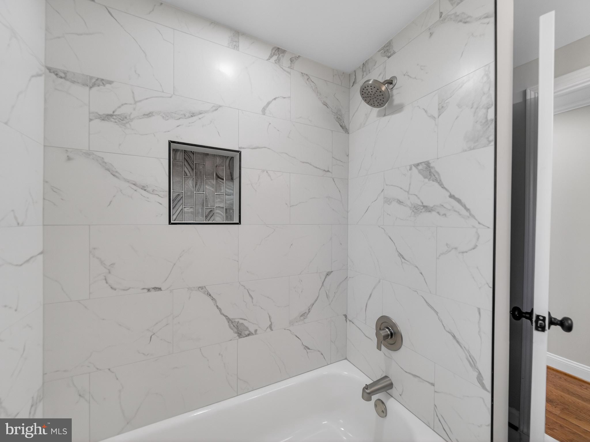 24676 Old 3 Notch Road Hollywood, MD 20636 - Photo 15 of 45 a bathroom with a bathtub