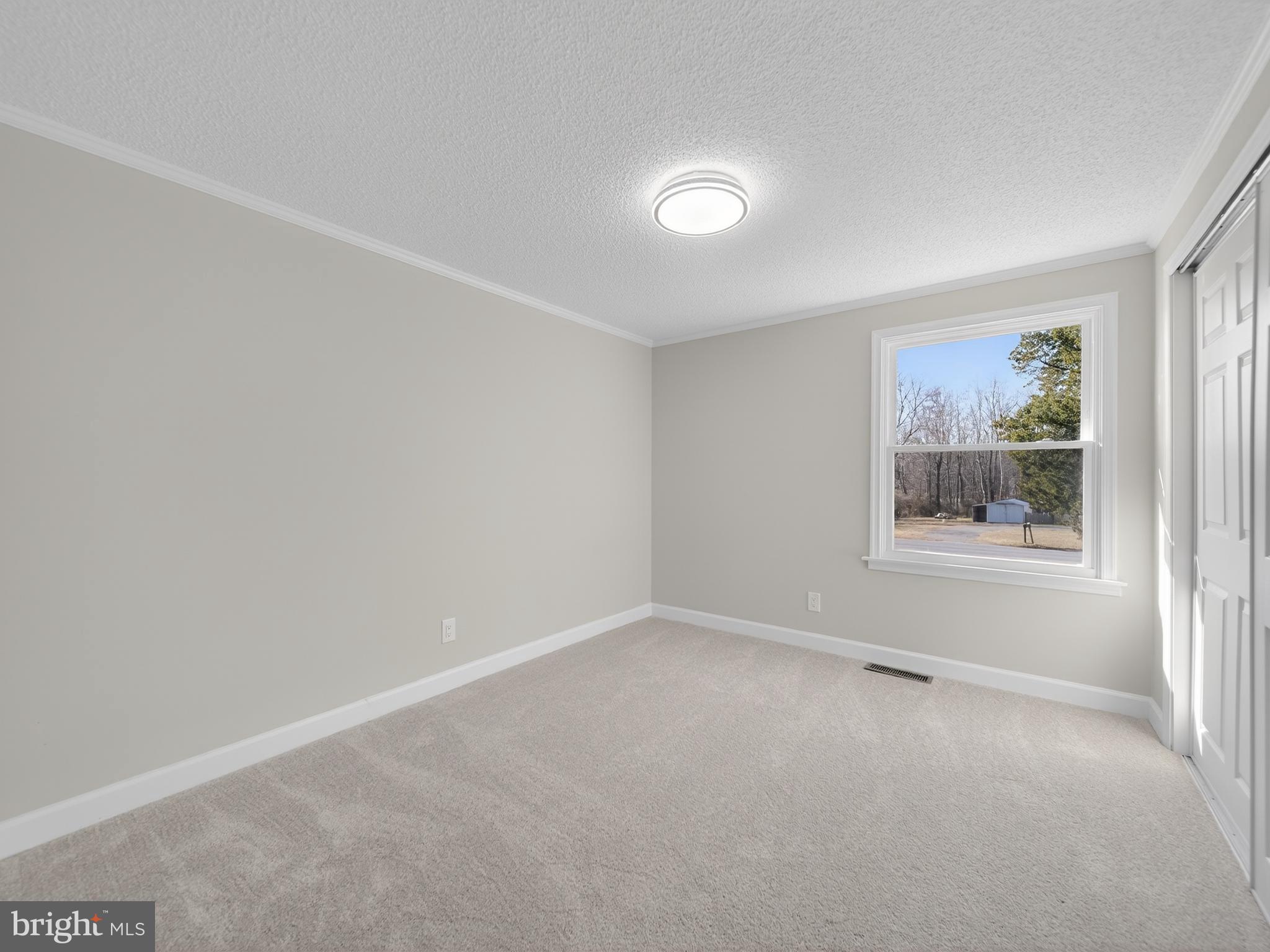 24676 Old 3 Notch Road Hollywood, MD 20636 - Photo 17 of 45 an empty room with windows