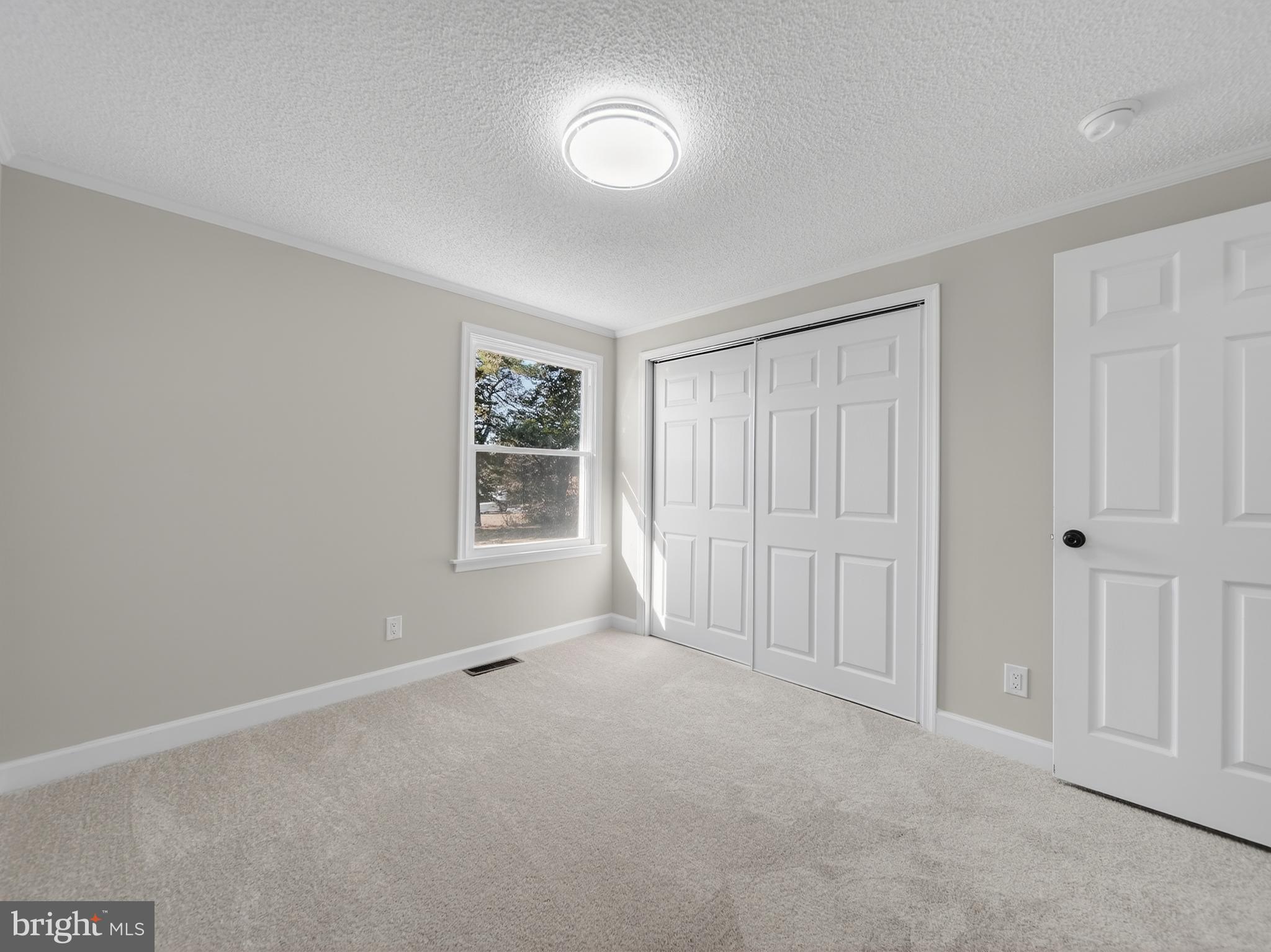 24676 Old 3 Notch Road Hollywood, MD 20636 - Photo 18 of 45 a view of an empty room with a window
