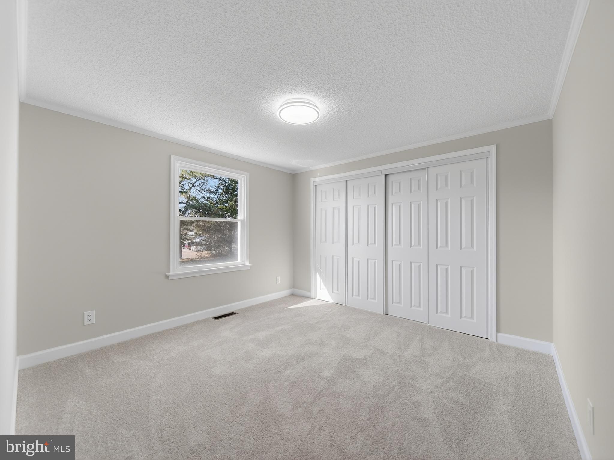 24676 Old 3 Notch Road Hollywood, MD 20636 - Photo 20 of 45 a view of an empty room with a window