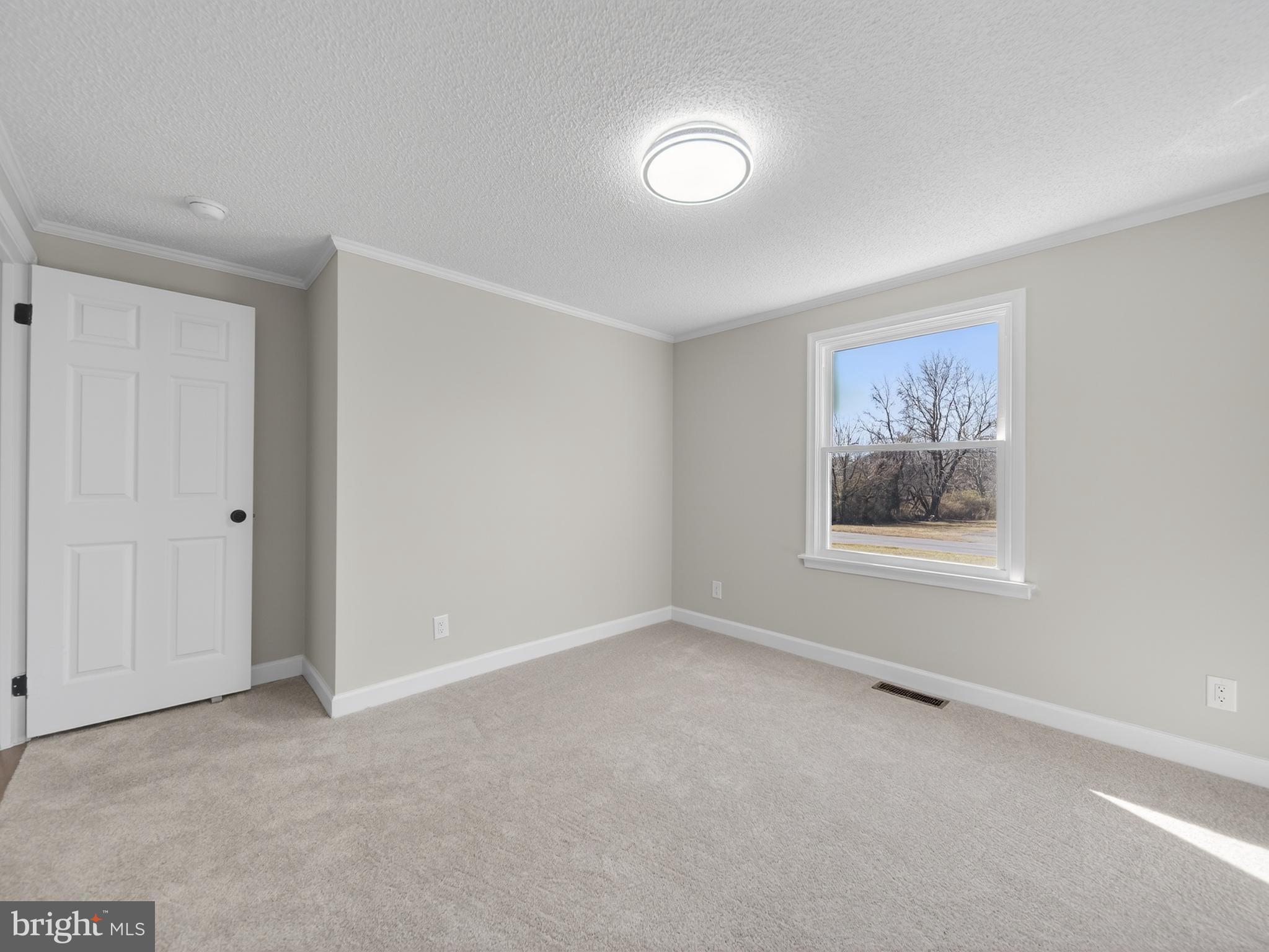 24676 Old 3 Notch Road Hollywood, MD 20636 - Photo 21 of 45 a view of an empty room with a window