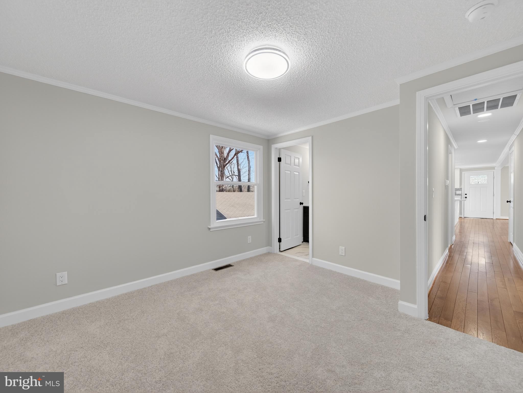 24676 Old 3 Notch Road Hollywood, MD 20636 - Photo 24 of 45 an empty room with windows and closet