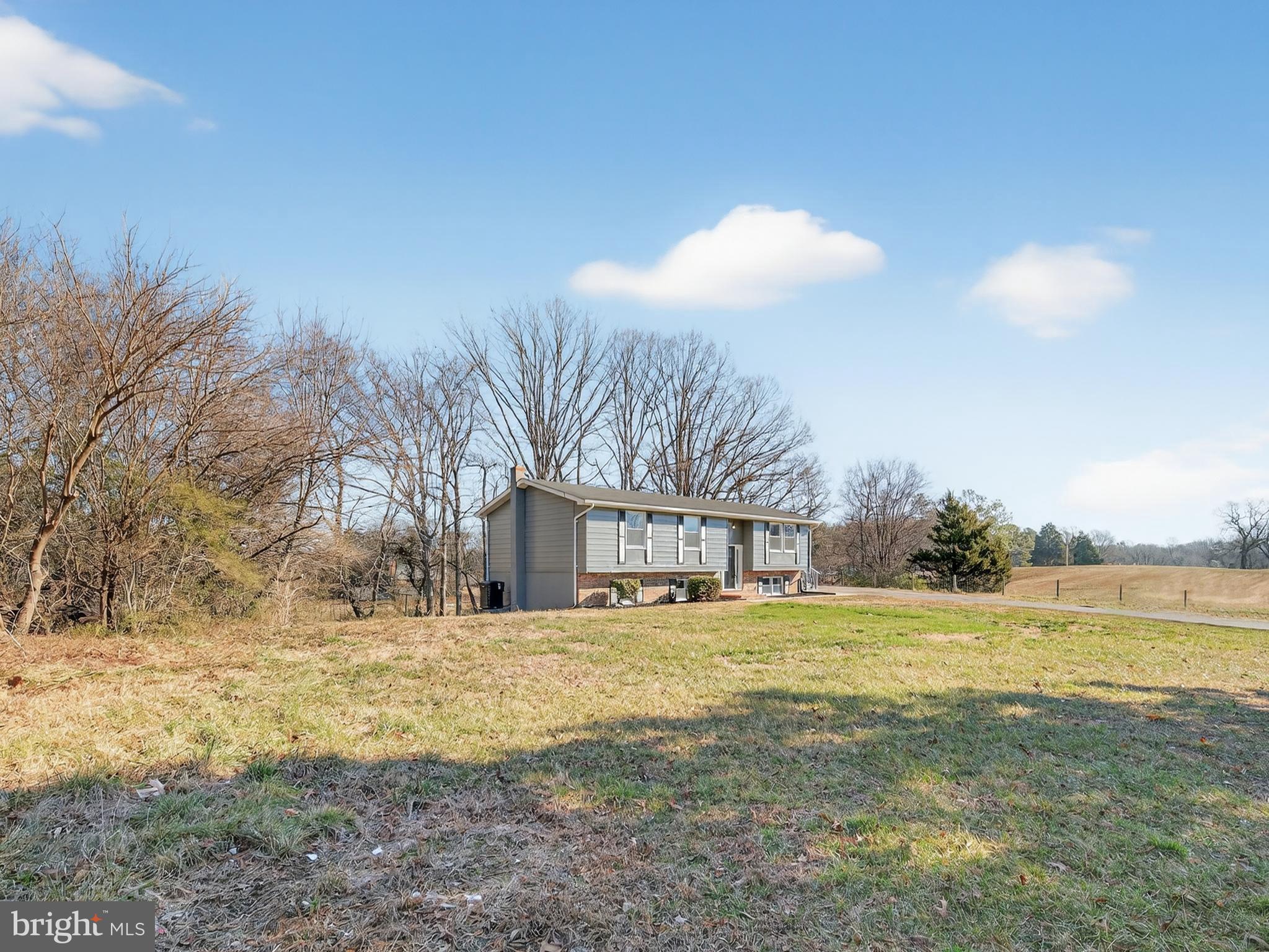 24676 Old 3 Notch Road Hollywood, MD 20636 - Photo 3 of 45 a view of a yard with a house