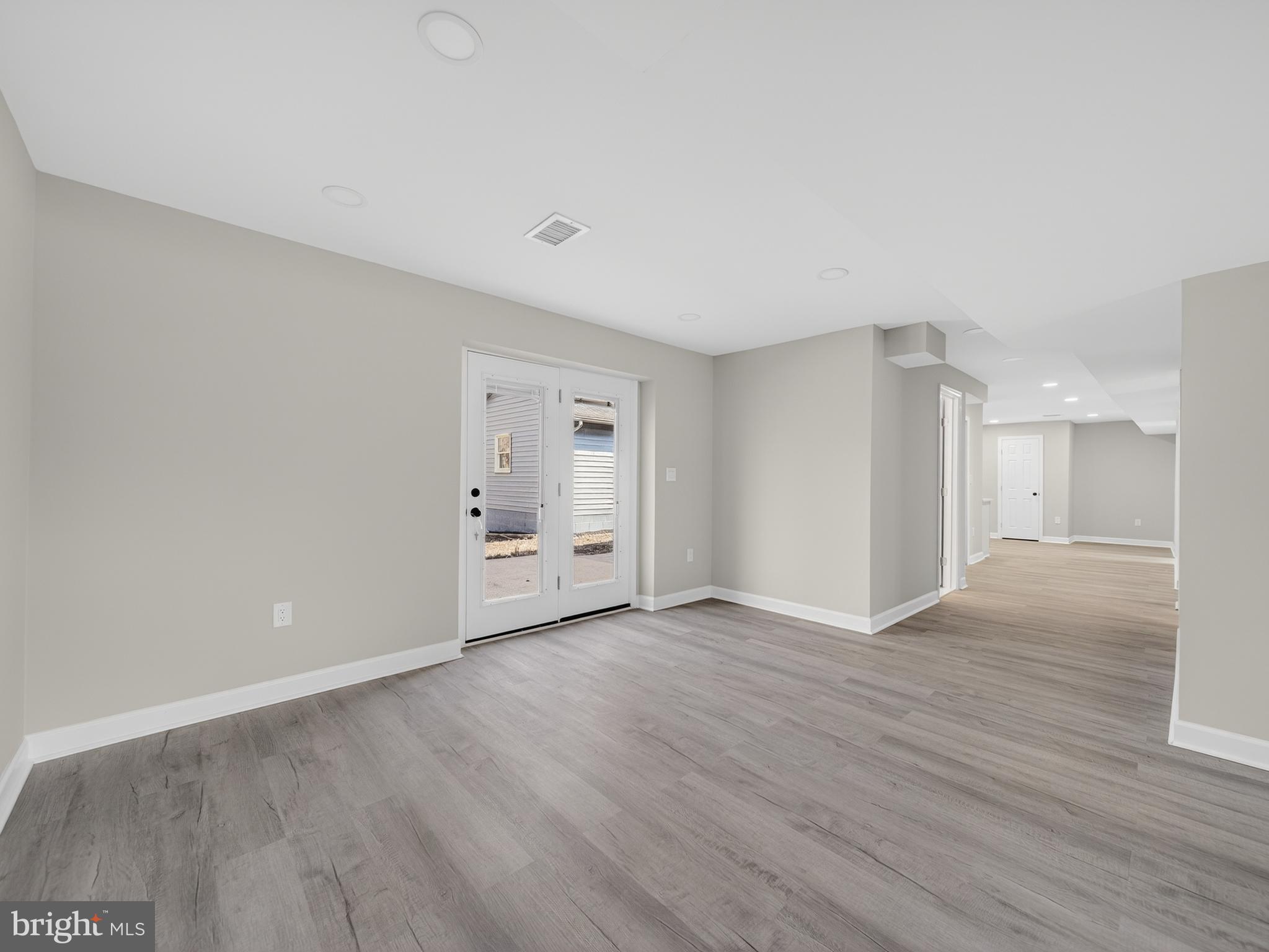 24676 Old 3 Notch Road Hollywood, MD 20636 - Photo 34 of 45 a view of an empty room with wooden floor