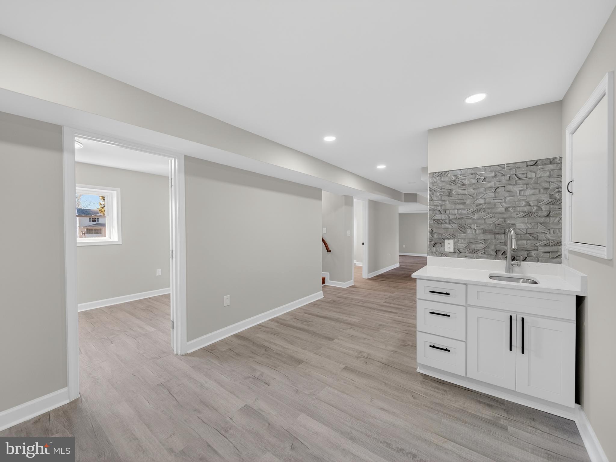 24676 Old 3 Notch Road Hollywood, MD 20636 - Photo 37 of 45 a view of cabinets a wooden floor and windows in a room