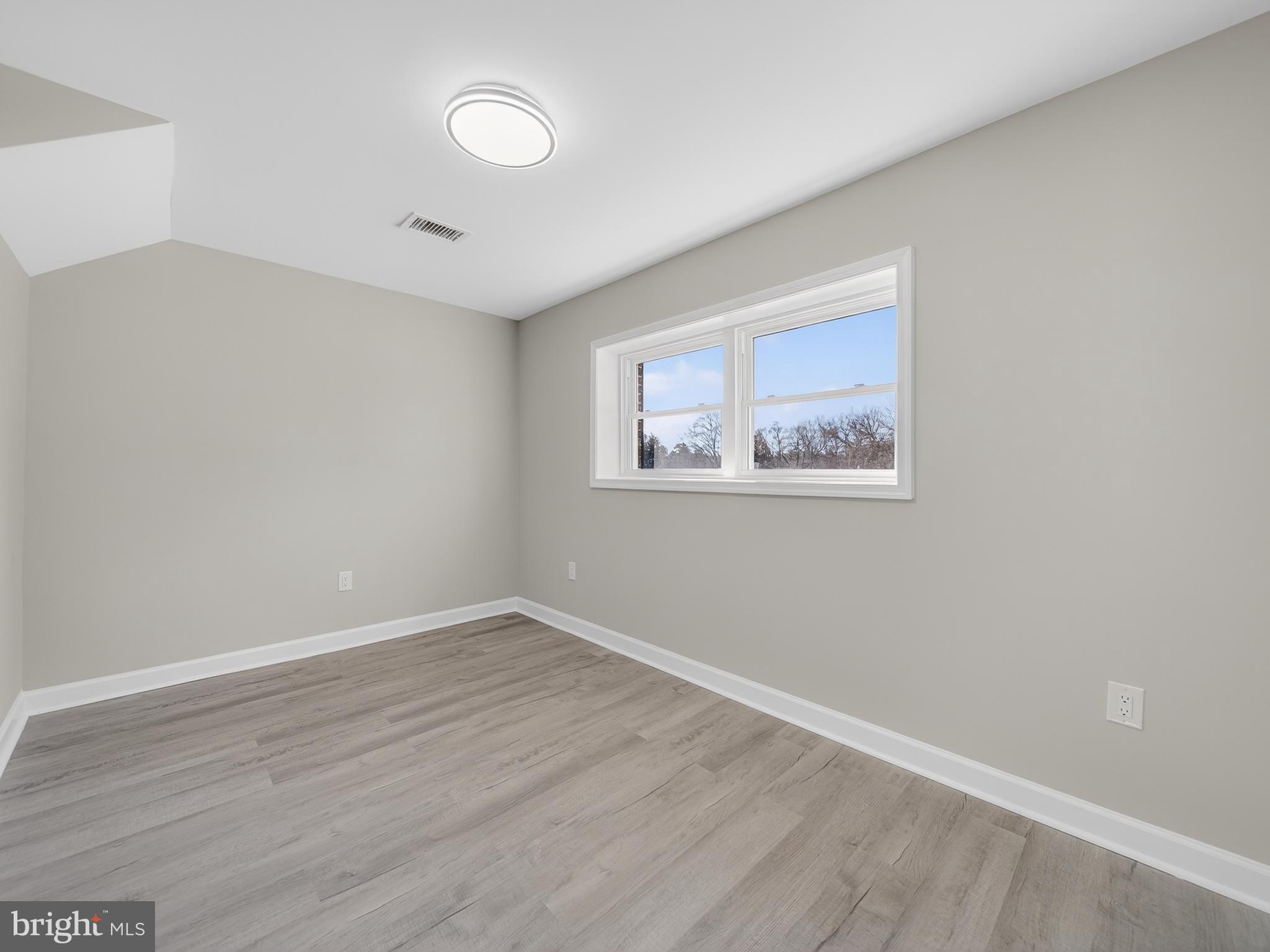 24676 Old 3 Notch Road Hollywood, MD 20636 - Photo 41 of 45 a view of an empty room with wooden floor
