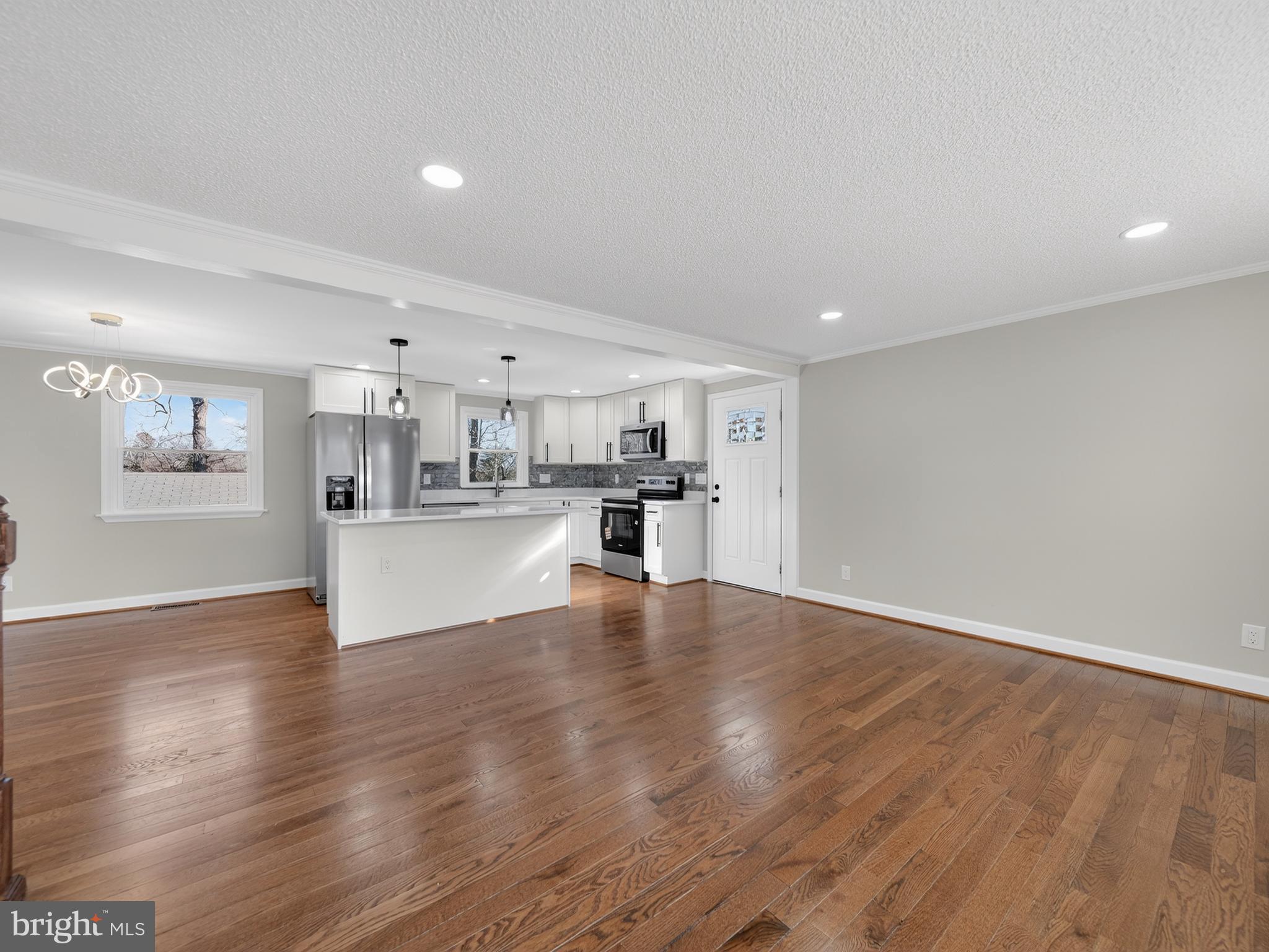 24676 Old 3 Notch Road Hollywood, MD 20636 - Photo 7 of 45 a view of a kitchen with wooden floor and a kitchen