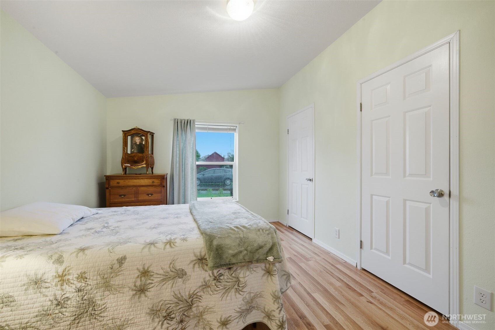 1913 7th Street Sedro-Woolley, WA 98284 - Photo 19 of 28 a bedroom with a bed and painting on the wall