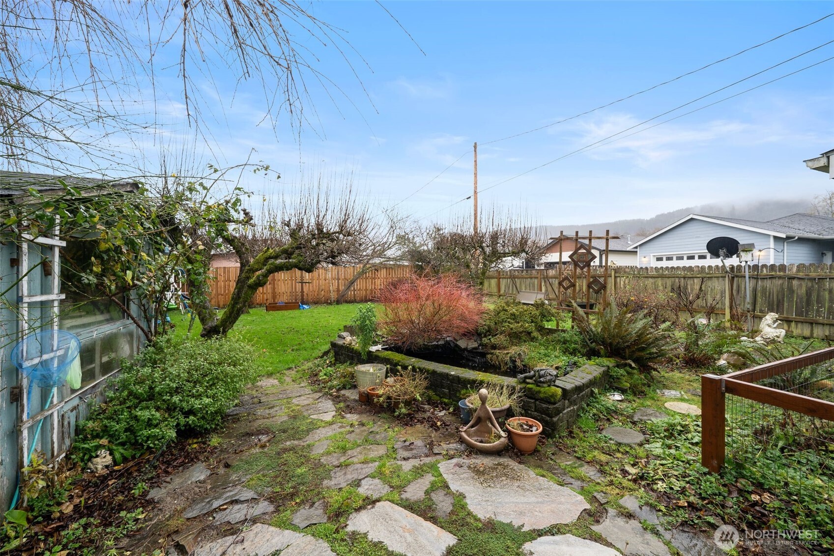 1913 7th Street Sedro-Woolley, WA 98284 - Photo 24 of 28 a view of a chair and table in the backyard