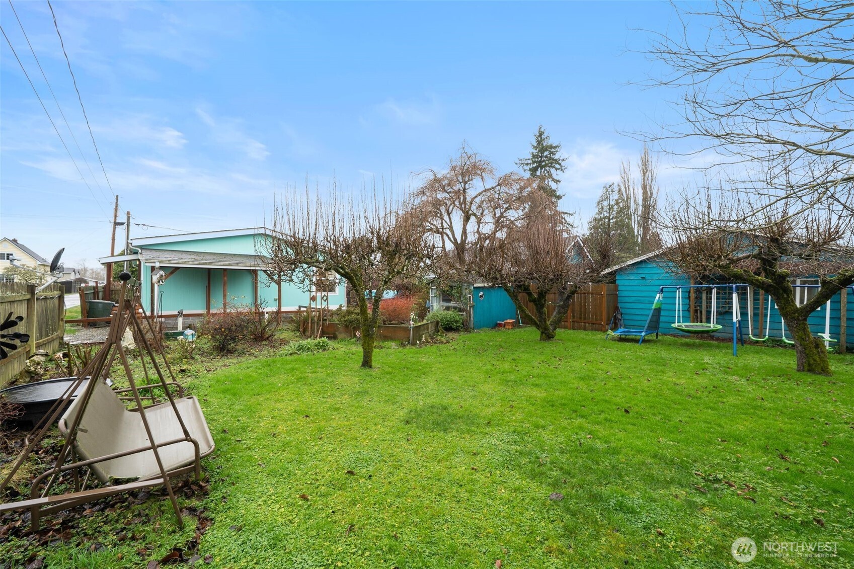 1913 7th Street Sedro-Woolley, WA 98284 - Photo 25 of 28 a view of a house with a yard