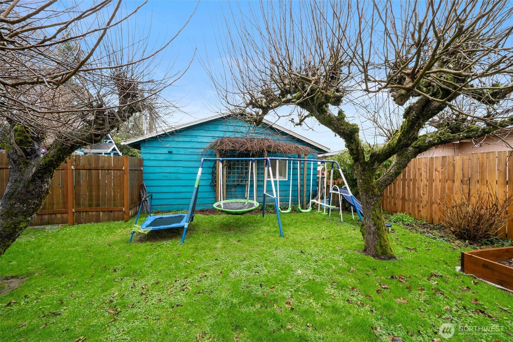 1913 7th Street Sedro-Woolley, WA 98284 - Photo 26 of 28 a view of a house with a yard table and chairs