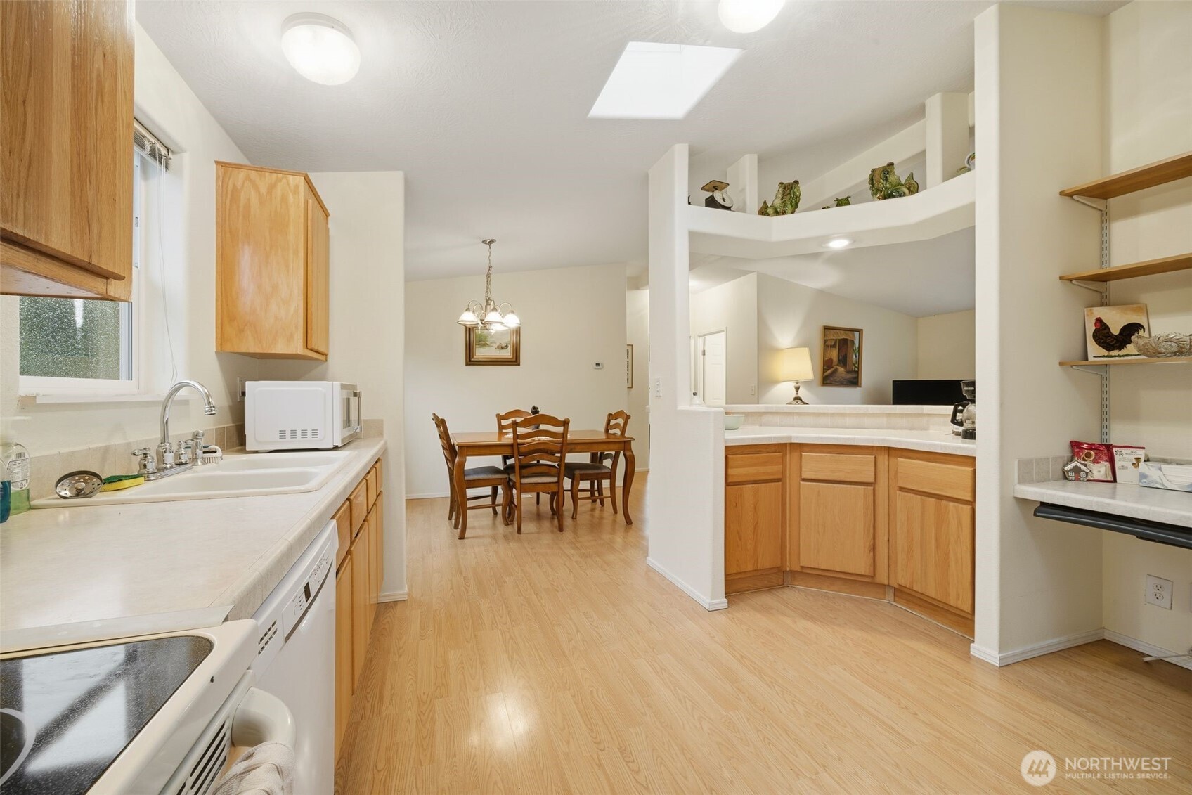 1913 7th Street Sedro-Woolley, WA 98284 - Photo 7 of 28 a large white kitchen with cabinets a sink and appliances