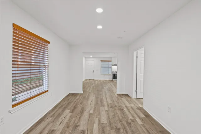 a view of kitchen and wooden floor