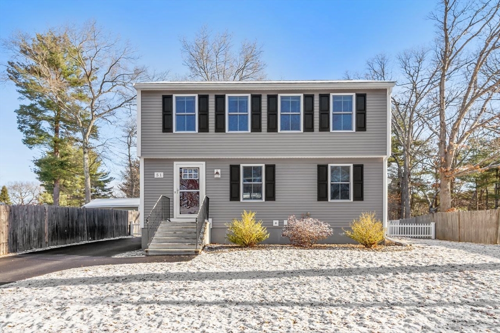 51 Valley Road Tewksbury, MA 01876 - Photo 1 of 17 a front view of a house with a yard