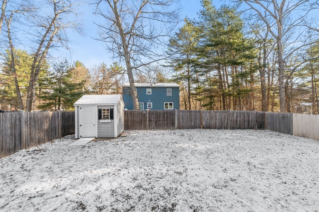 51 Valley Road Tewksbury, MA 01876 - Photo 16 of 17 a view of house with backyard and tree