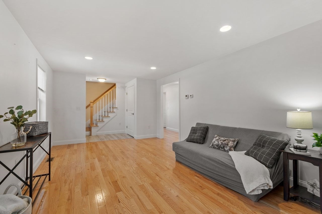 51 Valley Road Tewksbury, MA 01876 - Photo 3 of 17 a spacious bedroom with a bed and a lamp on table