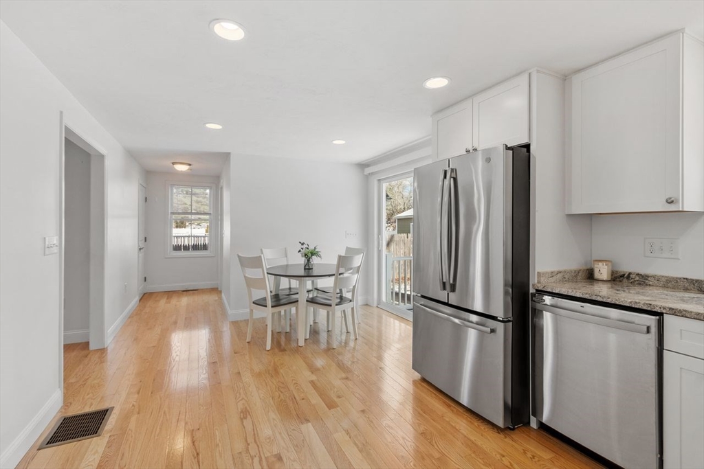 51 Valley Road Tewksbury, MA 01876 - Photo 6 of 17 a kitchen with granite countertop appliances furniture refrigerator and wooden floor