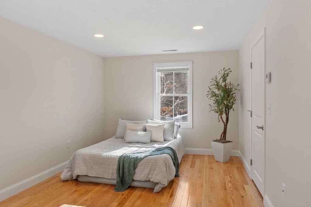 51 Valley Road Tewksbury, MA 01876 - Photo 10 of 17 a bedroom with a bed and a window