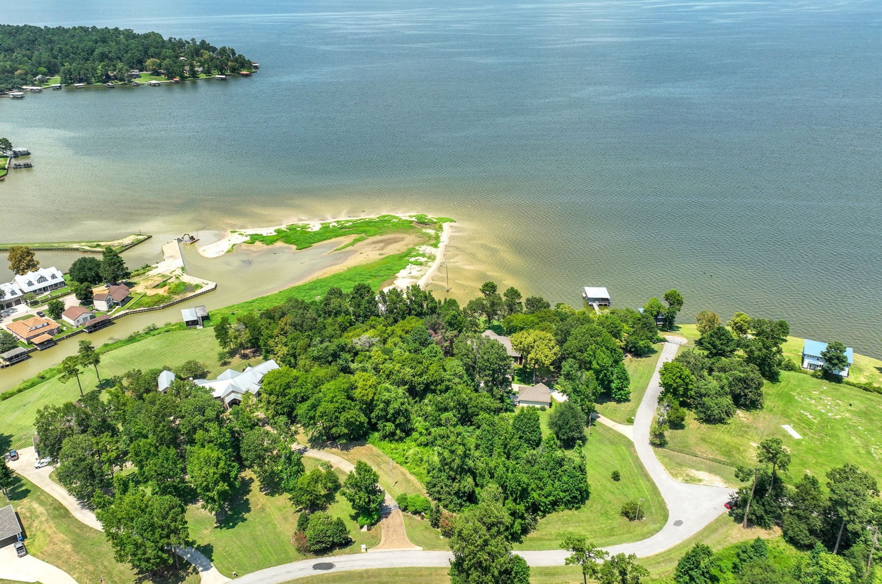 a view of a lake with a yard