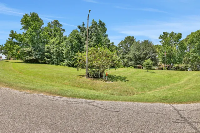 a view of a golf course with a house