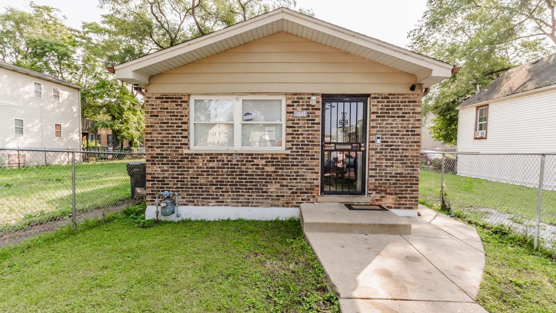 5141 South Carpenter Street Chicago, IL 60609 - Photo 1 of 23 a view of a house with a yard