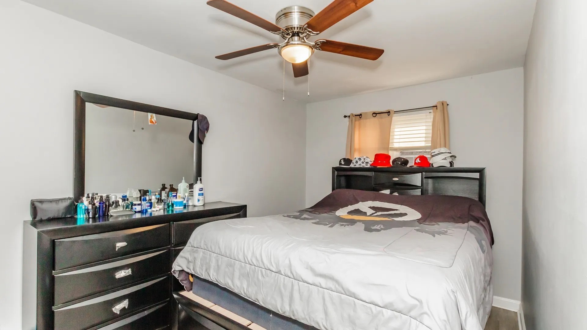 5141 South Carpenter Street Chicago, IL 60609 - Photo 13 of 23 a bedroom with a bed and a dresser