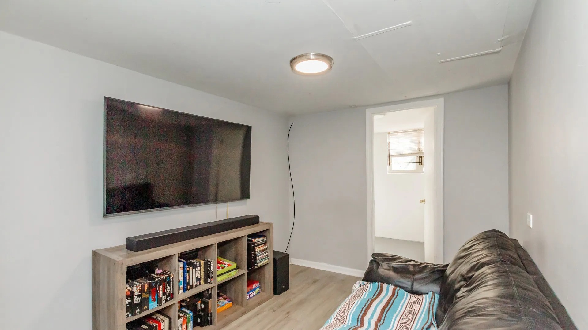 5141 South Carpenter Street Chicago, IL 60609 - Photo 3 of 23 a living room with furniture and a flat screen tv