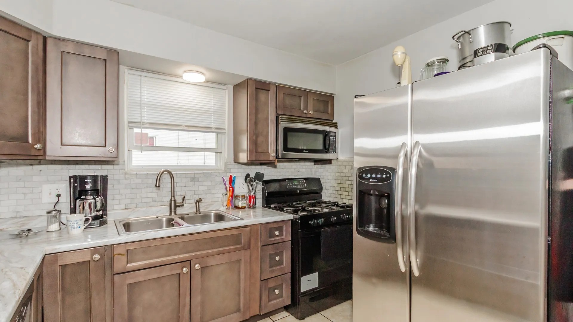 5141 South Carpenter Street Chicago, IL 60609 - Photo 8 of 23 a kitchen with a refrigerator and a sink