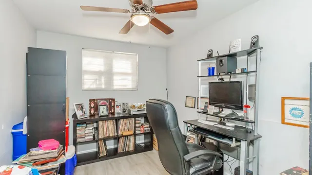 a workspace with furniture and wooden floor