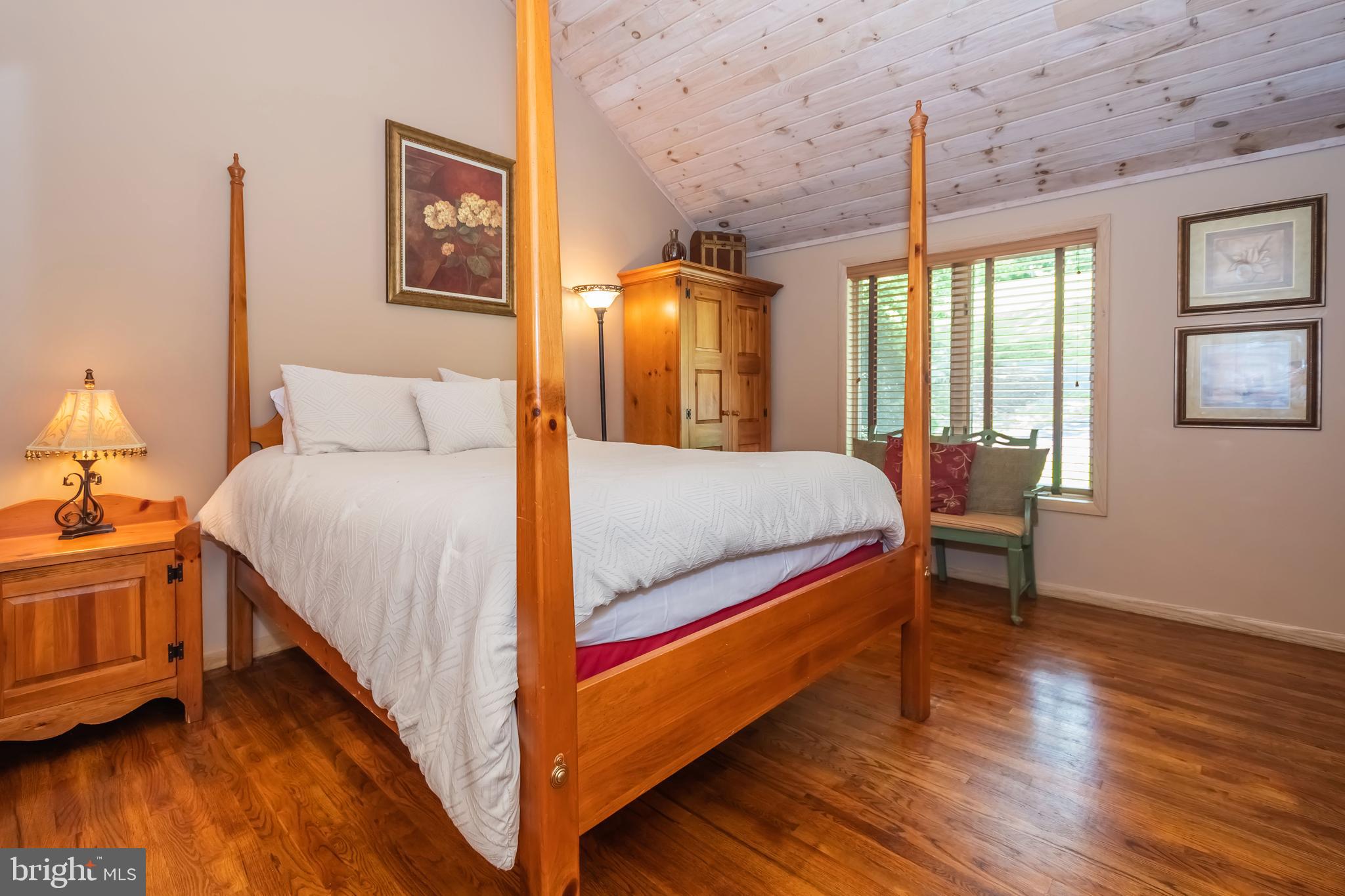 2345 Marsh Hill Road McHenry, MD 21541 - Photo 24 of 77 a bedroom with a bed and wooden floor