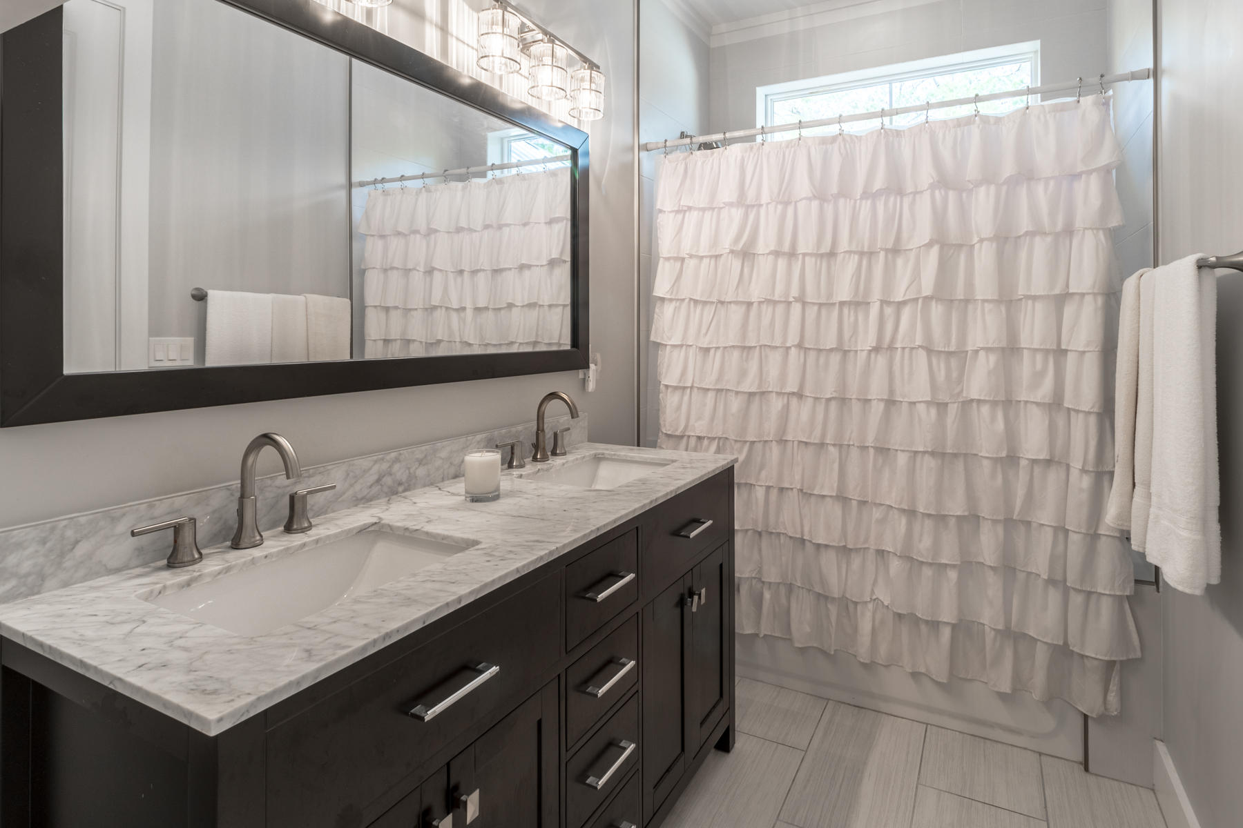 119 Michaela Lane Santa Rosa Beach, FL 32459 - Photo 11 of 28 a bathroom with a granite countertop sink a mirror and shower