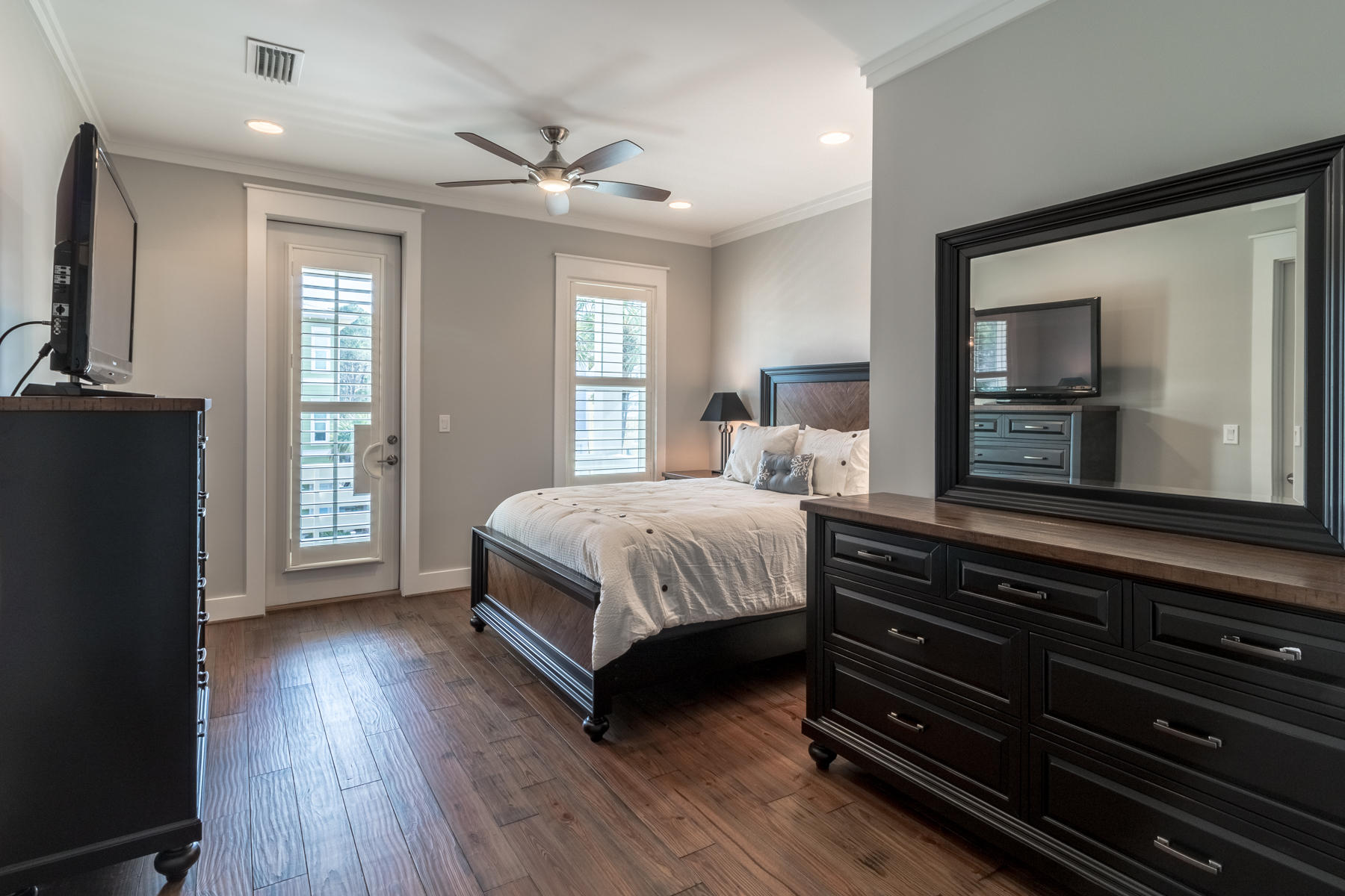 119 Michaela Lane Santa Rosa Beach, FL 32459 - Photo 12 of 28 a bedroom with a bed and wooden floor