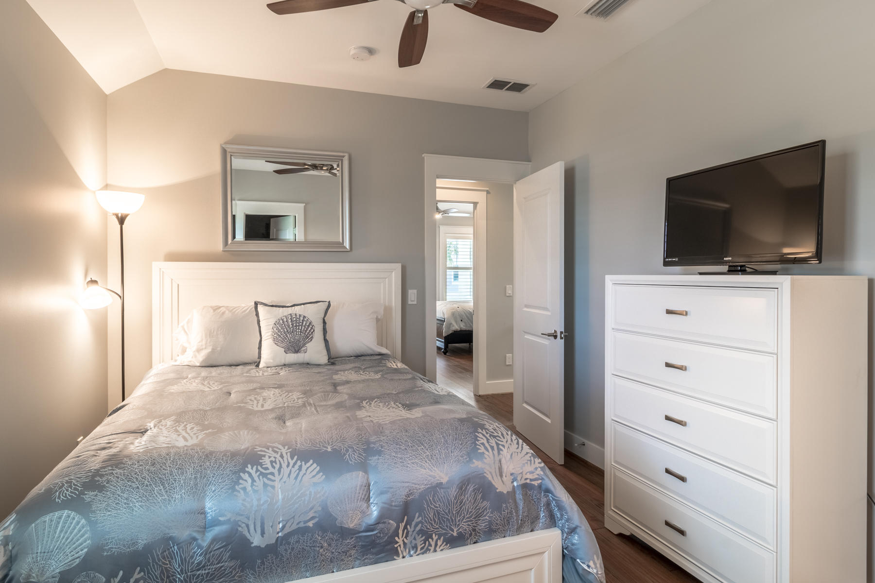 119 Michaela Lane Santa Rosa Beach, FL 32459 - Photo 16 of 28 a bedroom with a bed and a flat screen tv