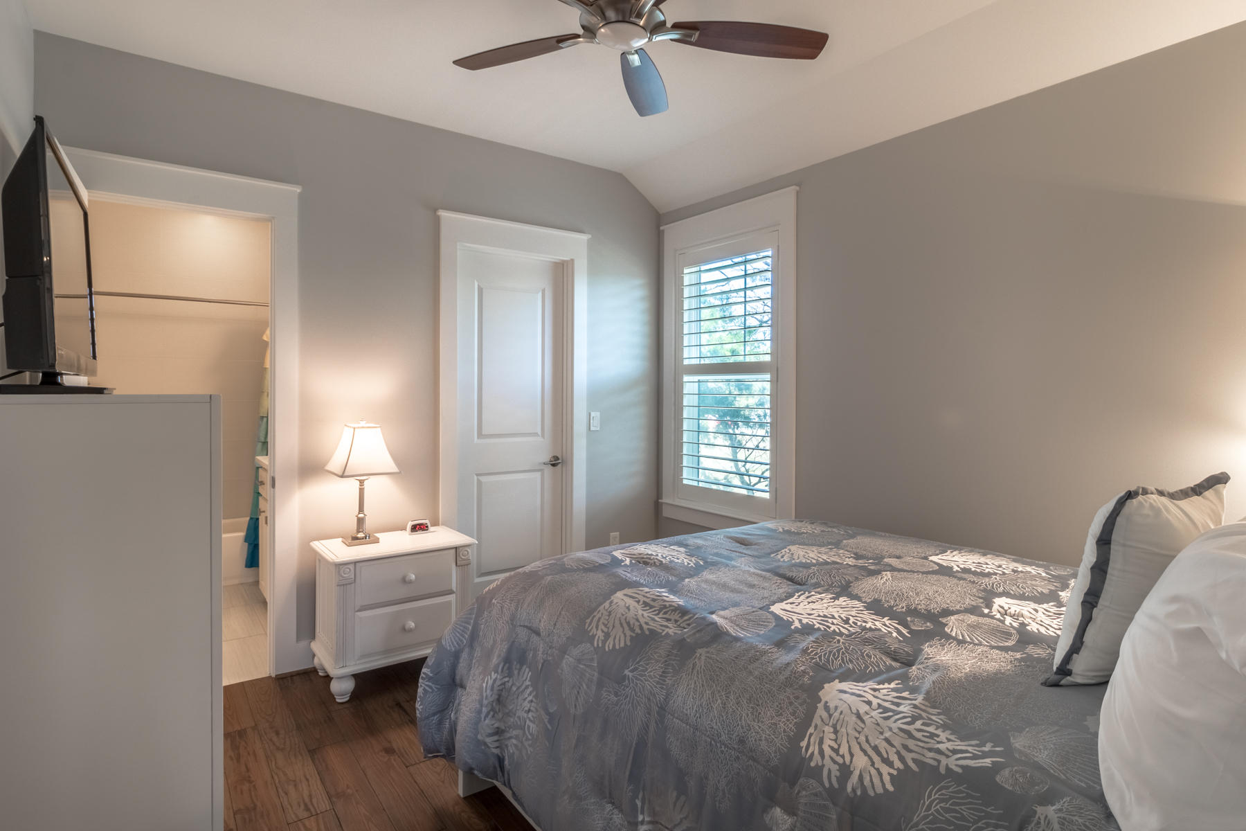 119 Michaela Lane Santa Rosa Beach, FL 32459 - Photo 17 of 28 a bedroom with a bed and a chandelier