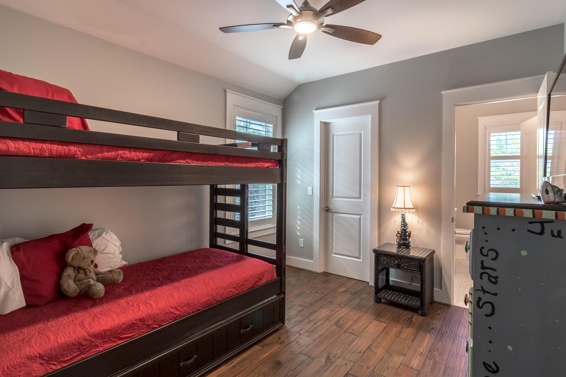 119 Michaela Lane Santa Rosa Beach, FL 32459 - Photo 20 of 28 a bedroom with a bed and wooden floor