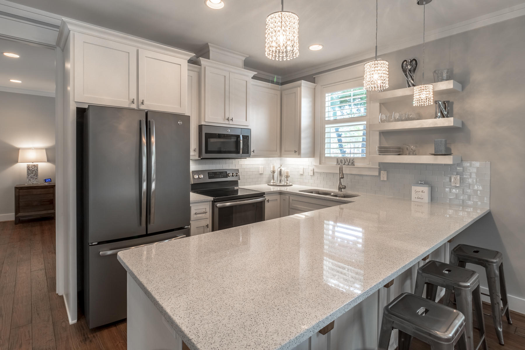 119 Michaela Lane Santa Rosa Beach, FL 32459 - Photo 3 of 28 a kitchen with stainless steel appliances granite countertop a sink a stove and a refrigerator