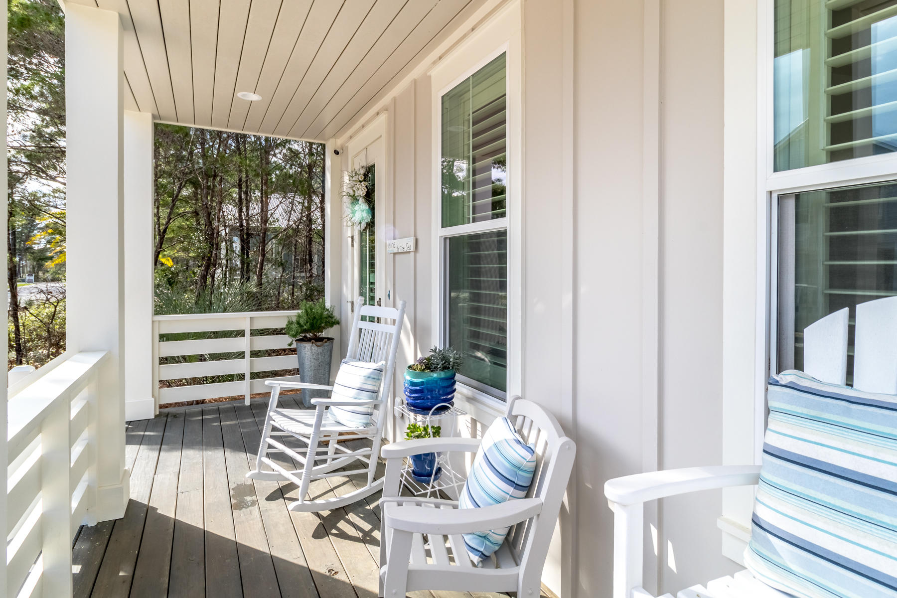 119 Michaela Lane Santa Rosa Beach, FL 32459 - Photo 8 of 28 a view of balcony and dining room with wooden floor