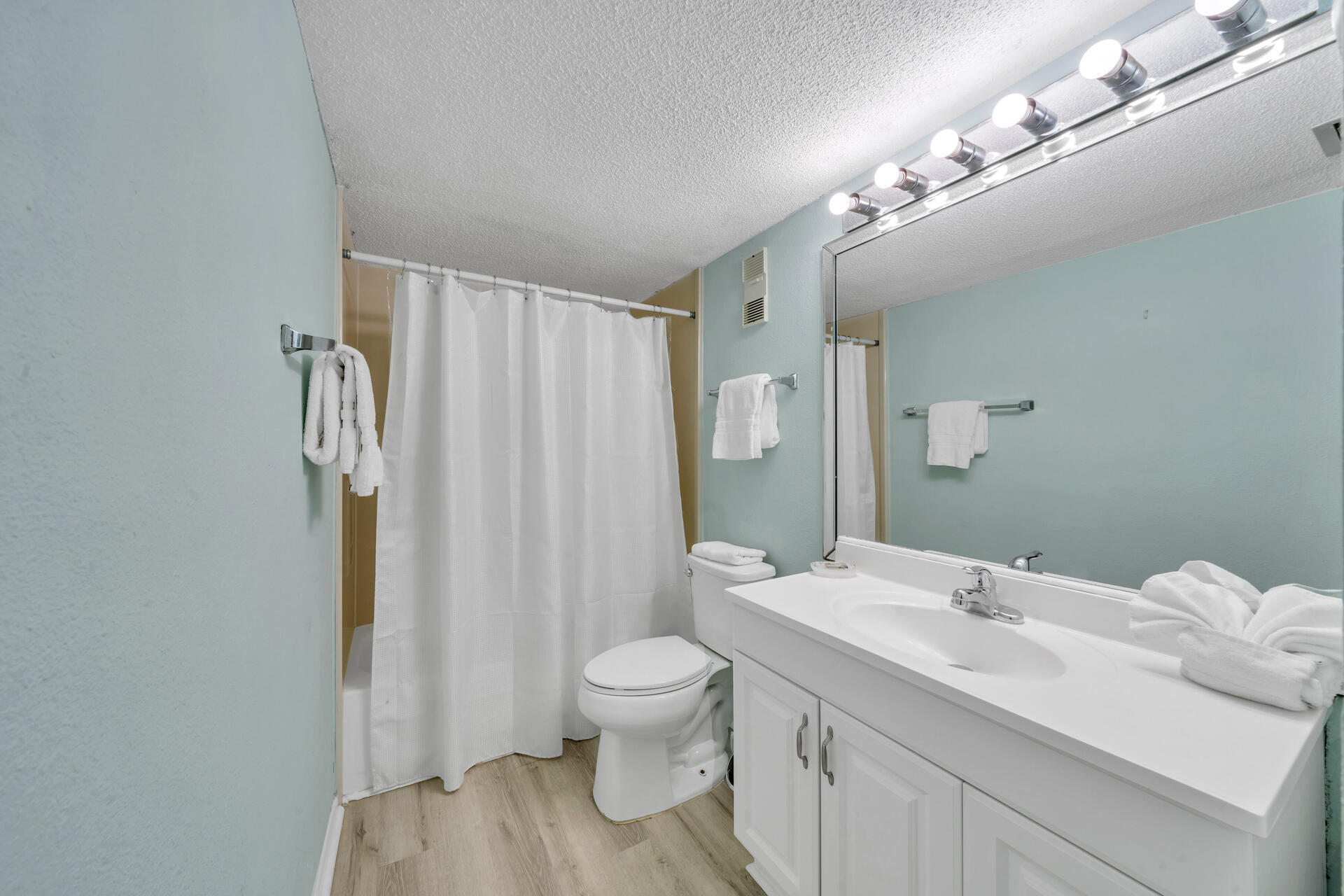 676 Santa Rosa Boulevard, Unit 4D Fort Walton Beach, FL 32548 - Photo 11 of 30 a bathroom with a sink a toilet and shower