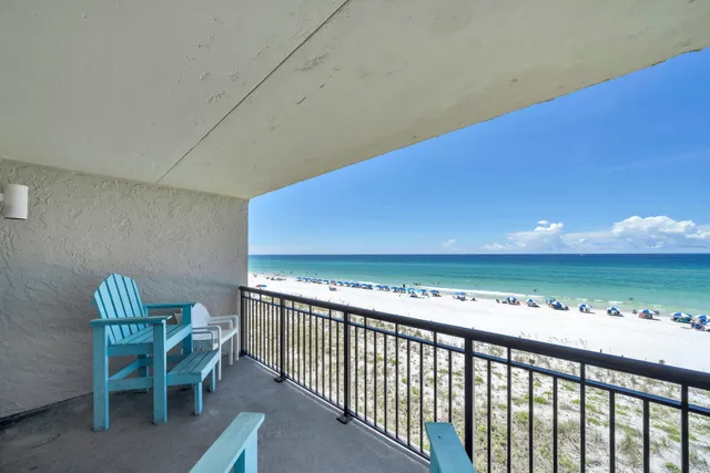 a view of a chairs and table in patio