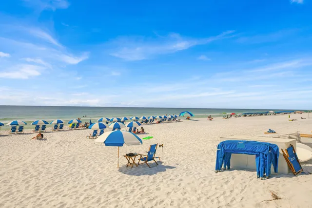 a view of a hallway with wooden floor and stairs
