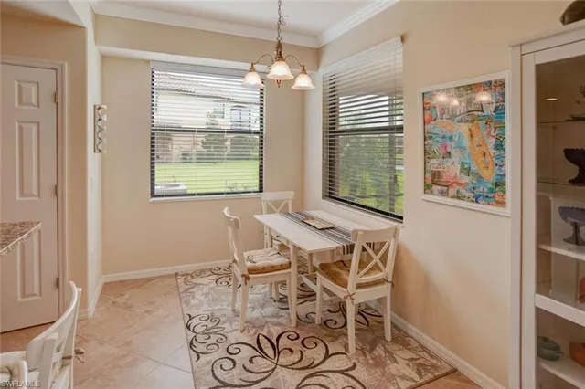a dining room with furniture and window