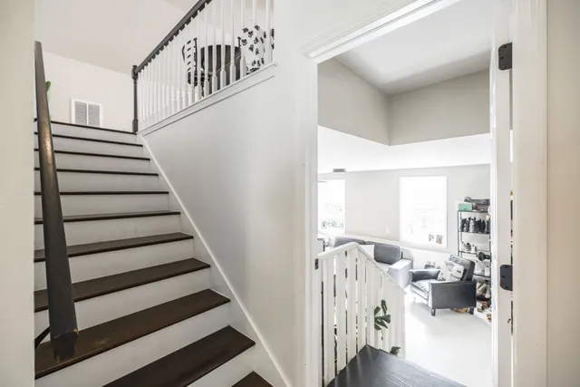 a view of a house with a yard and furniture