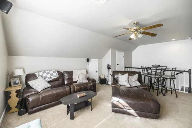 a view of a house with swimming pool and a yard