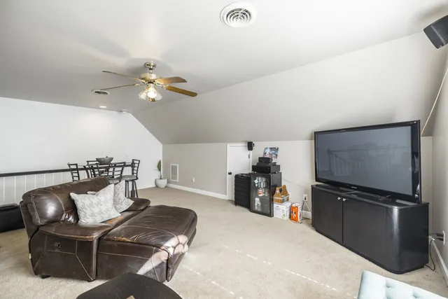 a view of a house with a swimming pool and a yard