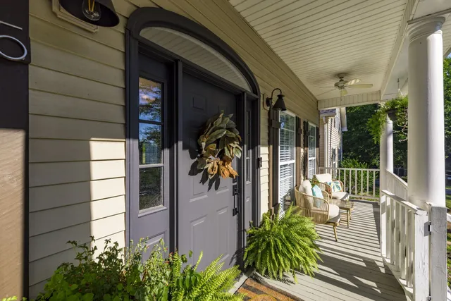 a living room with furniture and a lamp