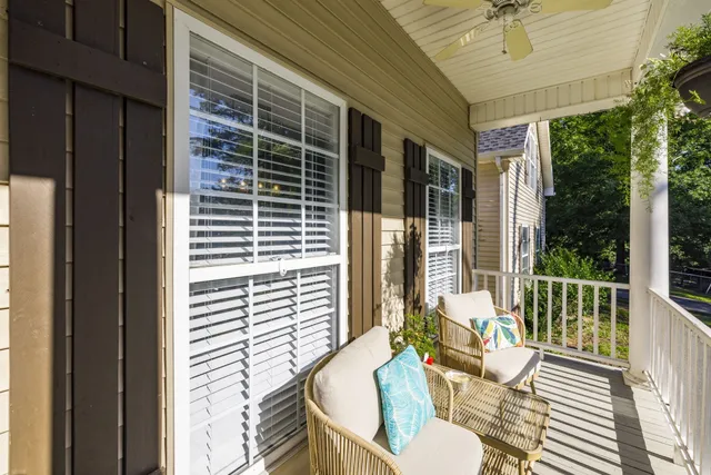 a view of living room with furniture and wooden floor