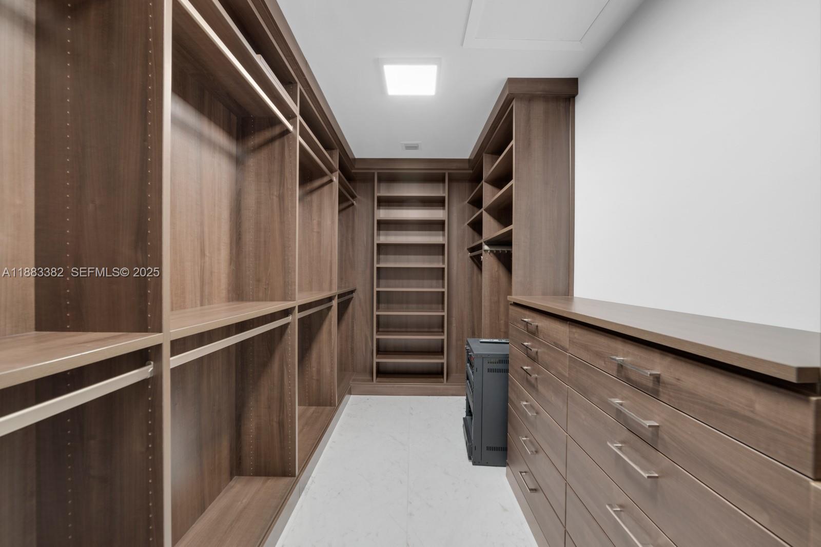 1643 Brickell Avenue, Unit PH4902 Miami, FL 33129 - Photo 17 of 38 a view of walk in closet with stairs